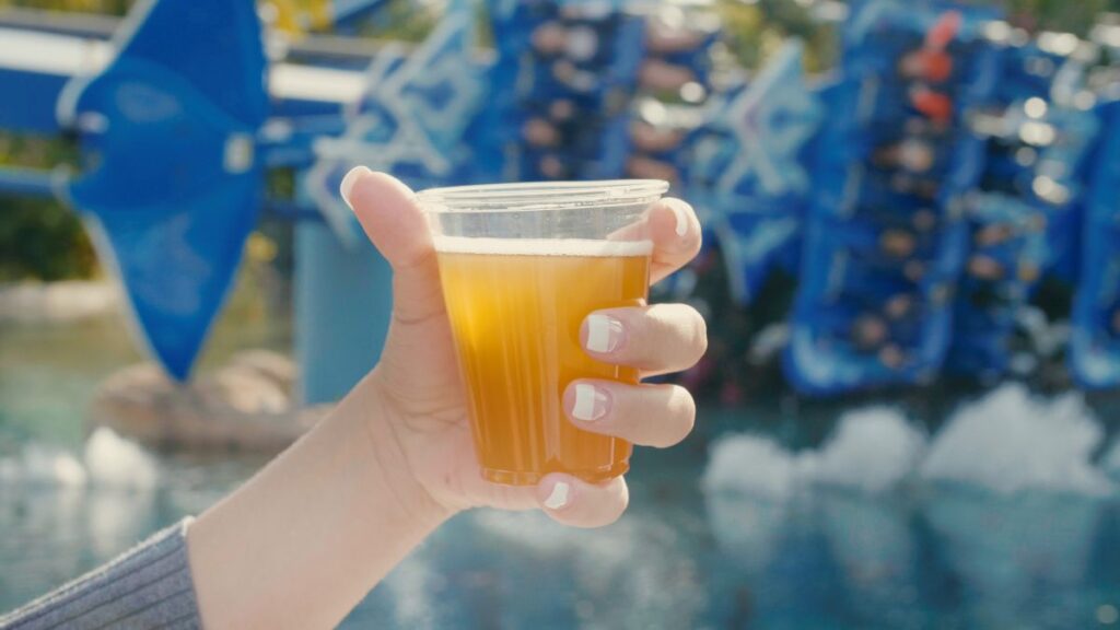 SeaWorld Orlando photo showing a hand holding a beer