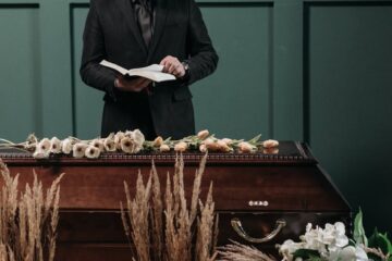 a man in black suit