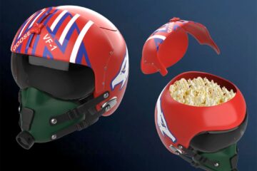 Promotional Top Gun image with two red fighter pilot helmets, one open to reveal popcorn inside the helmet.