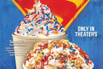 Promotional Cold Stone Supergirl treats poster for 'Supergirl' with a blue background, large shield logo, and two dessert cups topped with sprinkles; 'Only in theaters' text visible.