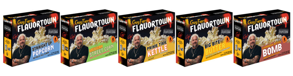 Five boxes of Flavortown microwave popcorn in a row, each with a different flavor: Straight Up Popcorn, Mexican Street Corn, Prime Time Kettle, Big Bite Butter, Cinnamon Butter Bomb.