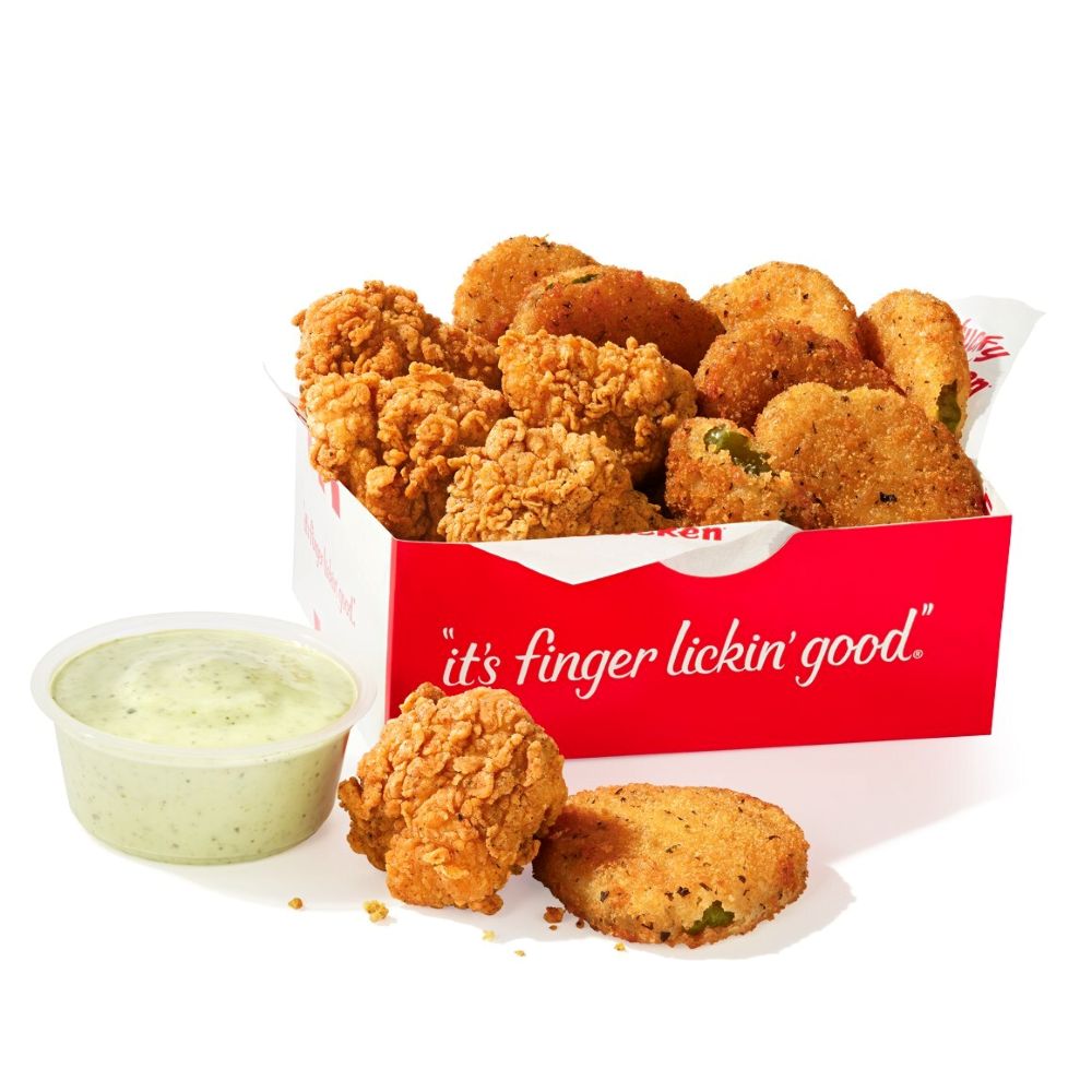 Red box of KFC fried pickles, plus a cup of creamy dipping sauce on the side.