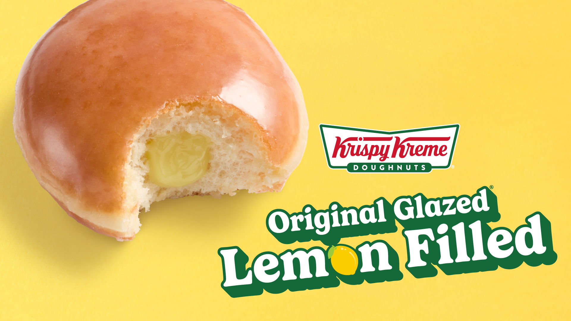 Close-up of a glazed lemon-filled doughnut with a bite taken out, featuring a yellow background and Krispy Kreme branding.