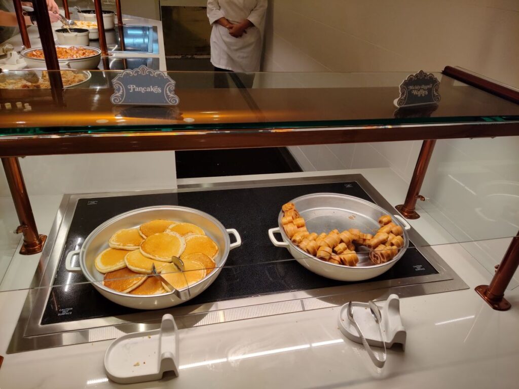 Buffet hot plate with pancakes on the left and rolled waffles on the right, labeled Pancakes and Waffles.