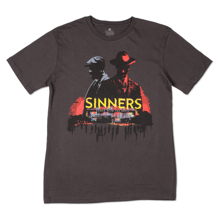 Dark gray T-shirt featuring a red–black graphic of two men in hats, with the yellow word 'SINNERS' across the chest and a small subtitle beneath.