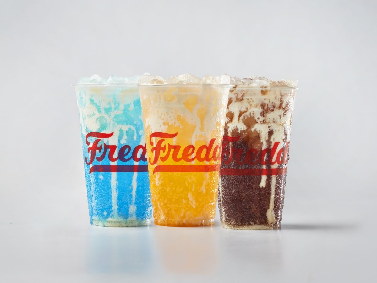 Freddy's new lineup of premium beverages, Freddy's Bevies, is now available. Pictured from L to R: Blue Rizzberry Cream Soda, Golden Hour Orange Custard Cream Soda, Coco Loco Custard Cream Soda for your next Freddy's theme park break