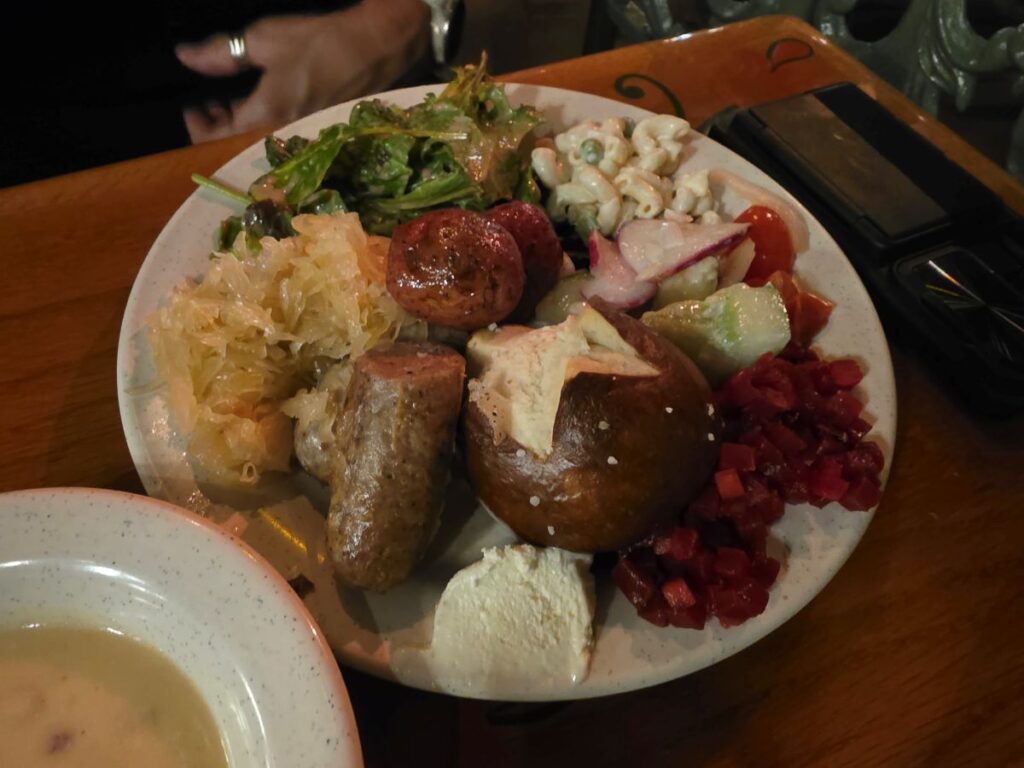 Biergarten Epcot review - plate full of hot food from the buffet