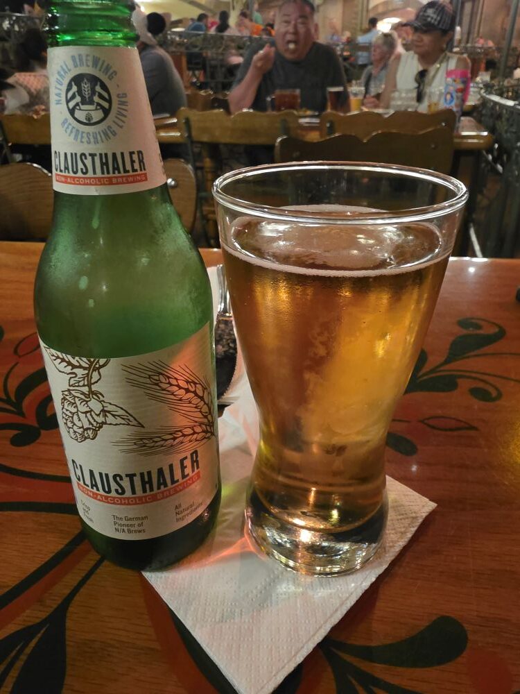bottle of non-alcoholic beer nest to a beer glass