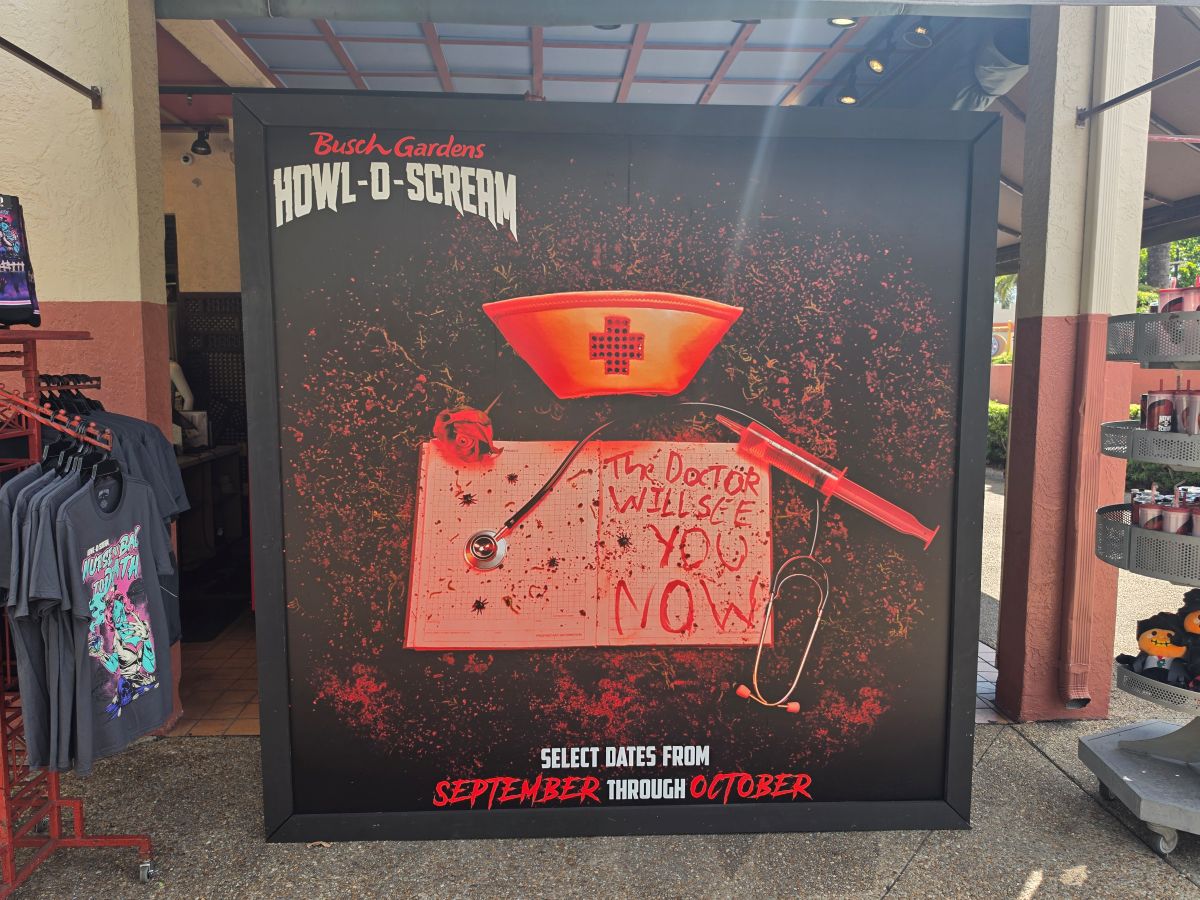 Busch Gardens Howl-O-Scream 2026 promotional display board featuring a bloody nurse hat, syringe, and clipboard reading The Doctor Will See You Now.