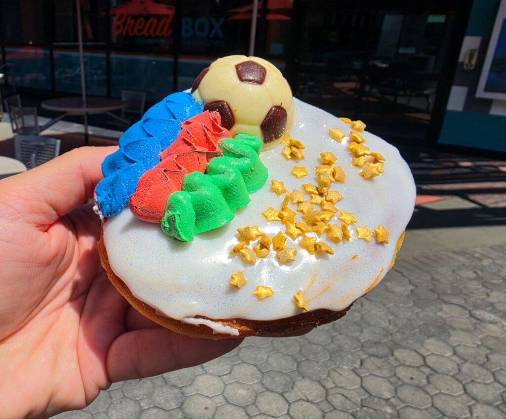 GOOOAALLLL! at Voodoo Doughnut - colorful doughnut with a white chocolate piece that looks like a soccer ball. It also features colorful stripes and candy stars
