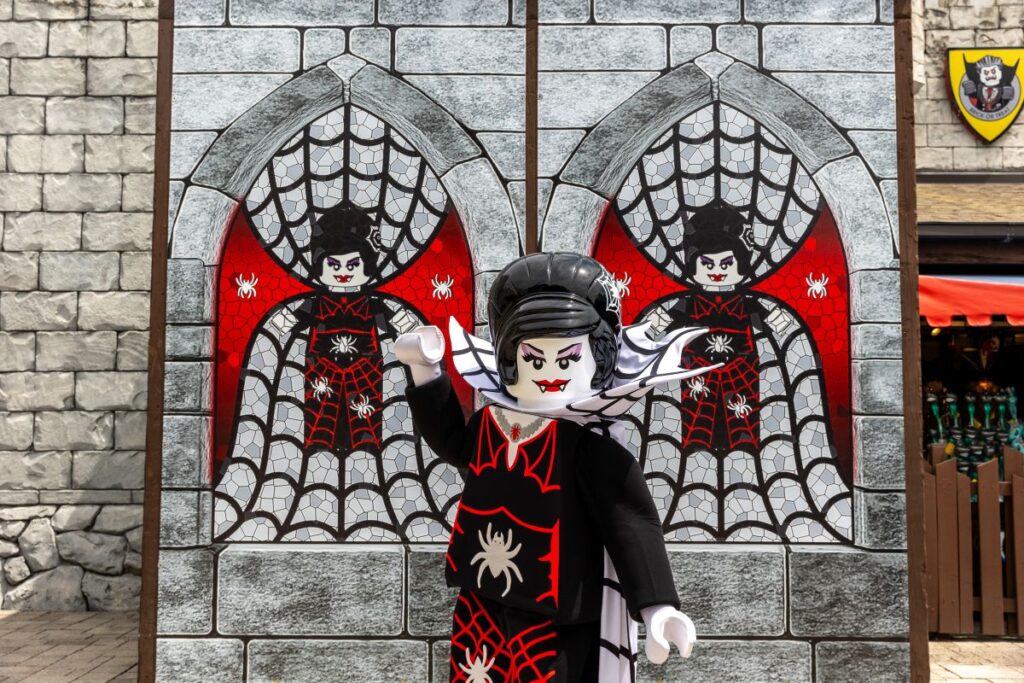 Lego Spider Lady in front of display