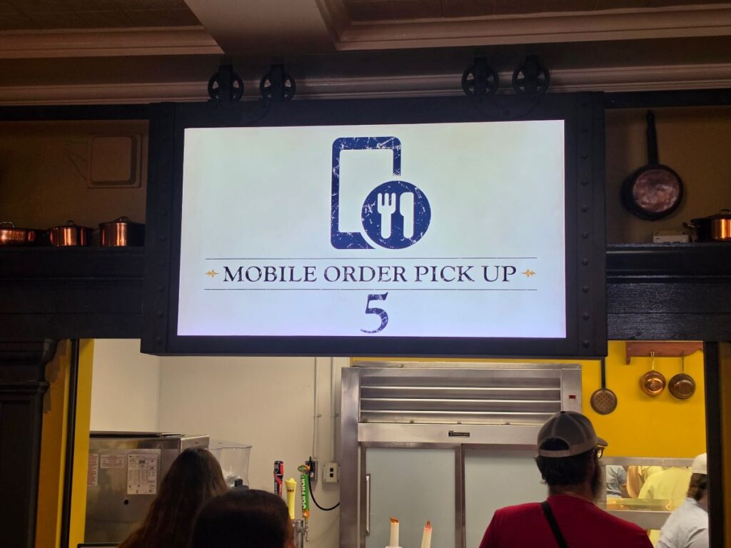 Mobile Order sign at Regal Eagle Smokehouse Epcot