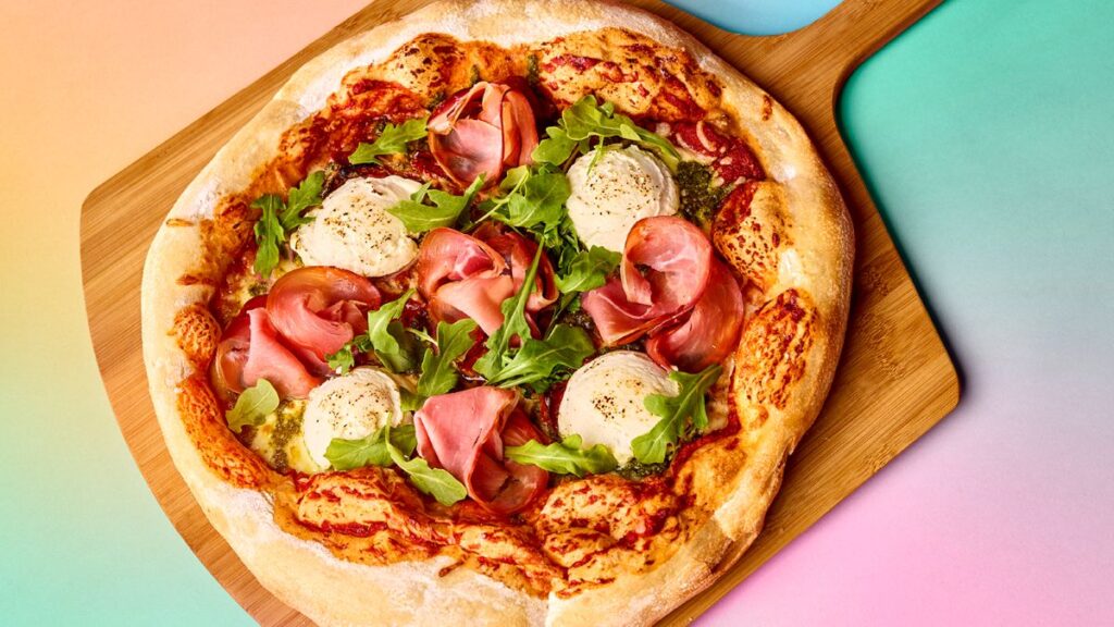 Prosciutto and arugula pizza served at Louie's Italian Restaurant for Universal Orlando Passholder Days.