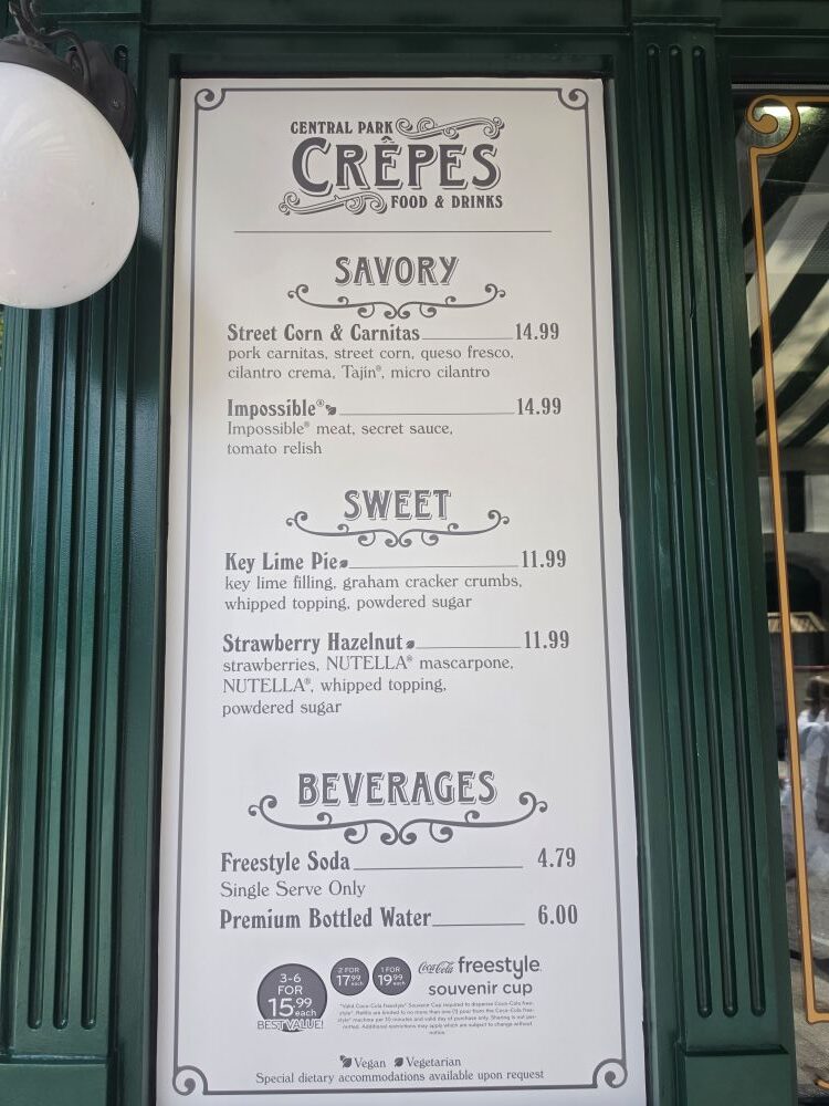 A close-up of the Central Park Crêpes menu board listing savory options like Street Corn & Carnitas, sweet options like Key Lime Pie and Strawberry Hazelnut, and beverage prices.
