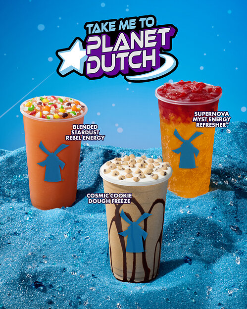 Promotional graphic for Dutch Bros featuring three seasonal drinks resting in blue sand against a blue sky. Text reads "TAKE ME TO PLANET DUTCH" with a star logo. The featured drinks are the Blended Stardust Rebel Energy, Cosmic Cookie Dough Freeze, and Supernova Myst Energy Refresher.