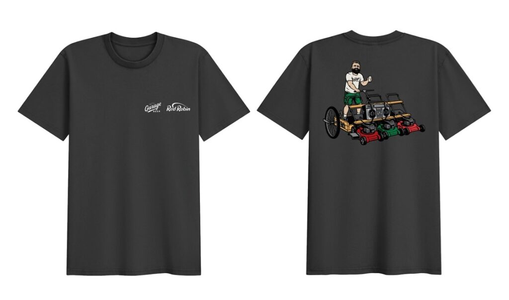 Black t-shirt displaying an illustration of a man operating a lawn mower amidst green grass.