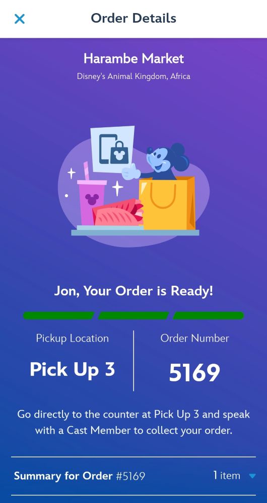 A screenshot of a Disney Mobile Order notification screen on a smartphone stating Jon Your Order is Ready from Harambe Market at Disney's Animal Kingdom.