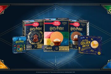 Five Harry Potter treats Betty Crocker baking kits, including cupcakes and cookies, are displayed on a blue background with Hogwarts house crests in the corners by General Mills