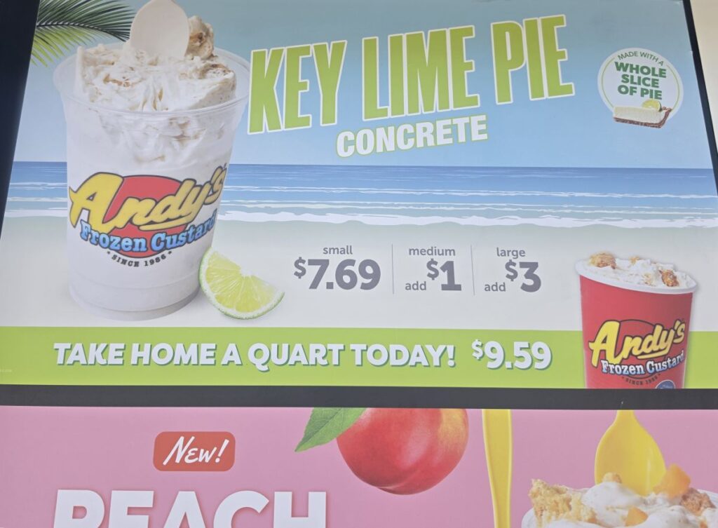 Menu board advertisement for Andy's Frozen Custard Key Lime Pie Concrete showing pricing for small, medium, large, and quart sizes.