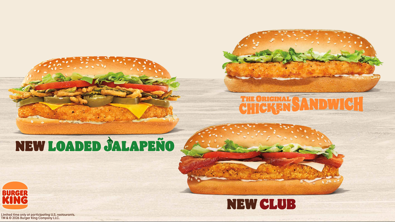 An advertisement for the new Burger King chicken sandwiches showcases three different options on long, sesame seed buns. On the left is the "New Loaded Jalapeño" sandwich, which features a crispy chicken patty topped with melted cheese, jalapeño slices, crispy fried onions, lettuce, and tomato. On the top right is "The Original Chicken Sandwich," featuring a crispy chicken patty, lettuce, and mayonnaise. On the bottom right is the "New Club" sandwich, topped with crispy chicken, bacon, cheese, tomato, and lettuce. The Burger King logo is in the bottom left corner against a light, neutral background.