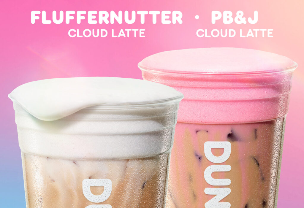 Close-up of Dunkin' Fluffernutter Cloud Latte with white foam and PB&J Cloud Latte with pink cold foam on a pink and blue gradient background.