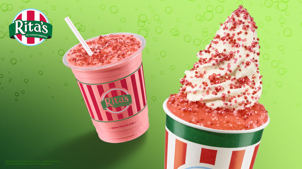 Rita's pink Shirley Temple Italian Ice drink with a straw next to a striped cup filled with red Italian ice topped with vanilla custard and red sprinkles on a green bubble background.