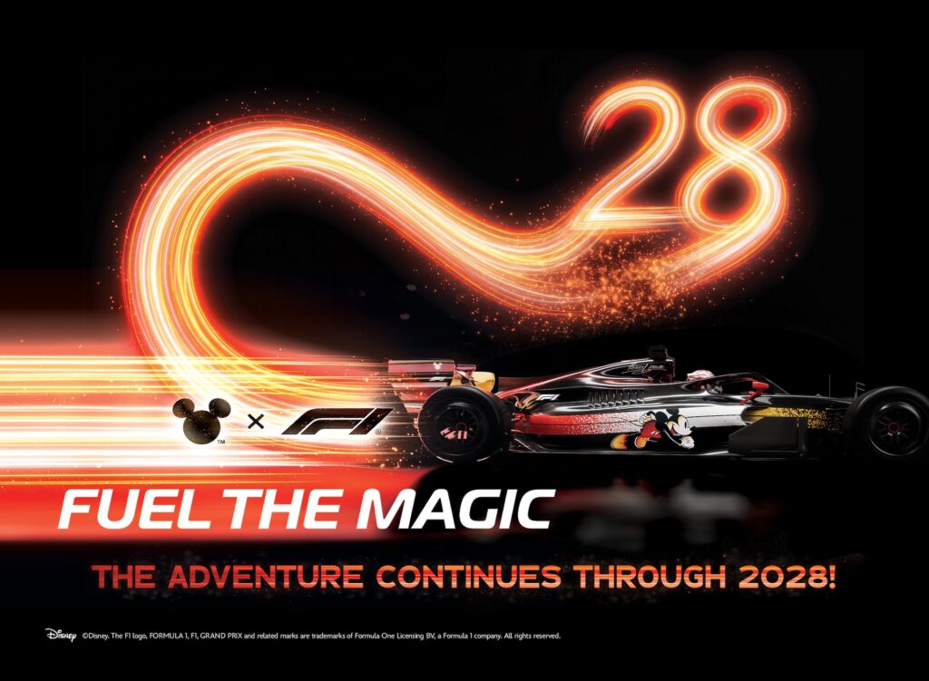 Disney and F1 collaboration graphic displaying a sleek race car adorned with Mickey Mouse graphic, dynamic light trail forming the number 28, and text reading "Fuel The Magic: The Adventure Continues Through 2028!"