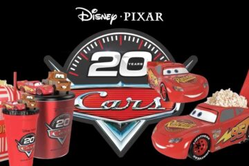 Disney Pixar Cars 20th anniversary merchandise featuring a popcorn bucket shaped like Lightning McQueen, themed cups, and a logo on a black background.