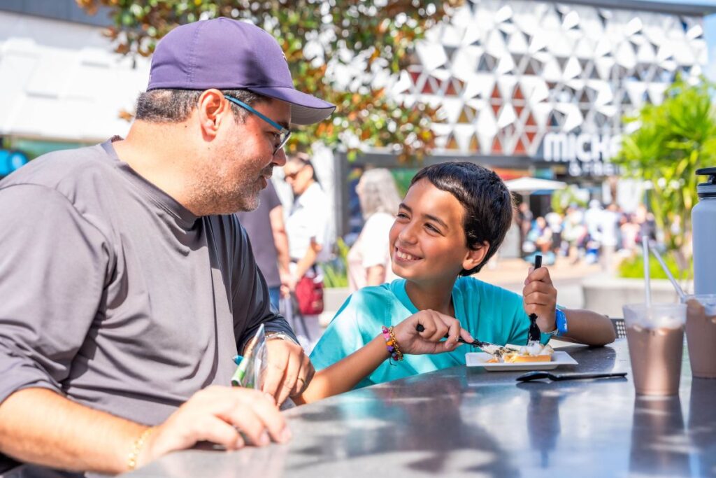 Adult and child enjoying Epcot Food & Wine