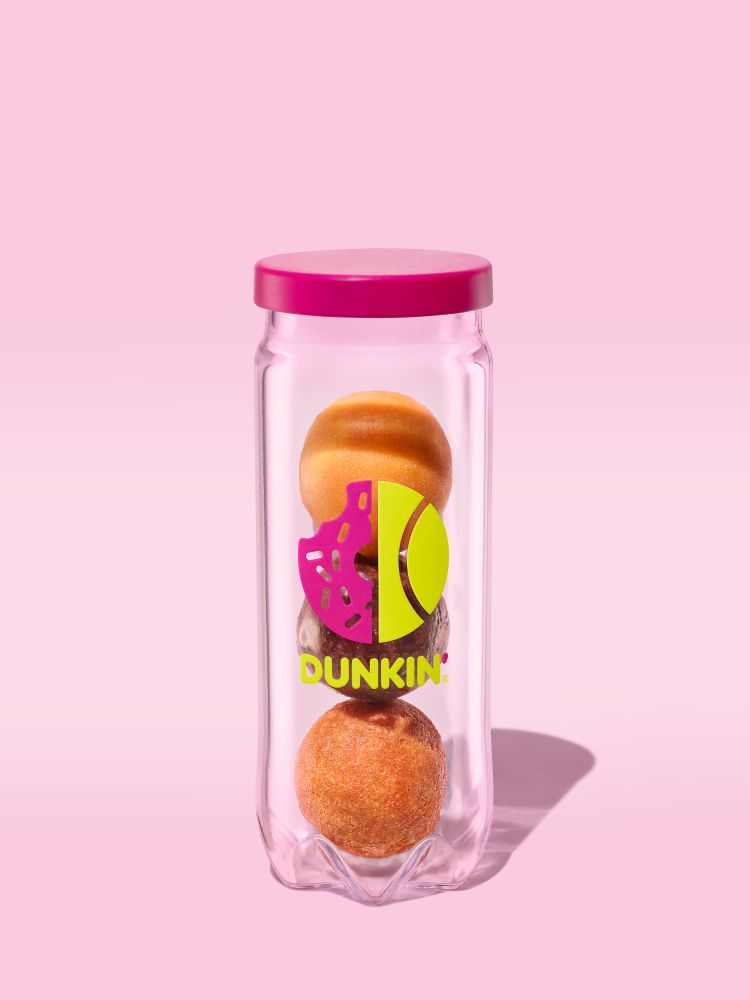 limited edition tennis ball can with three donut holes inside