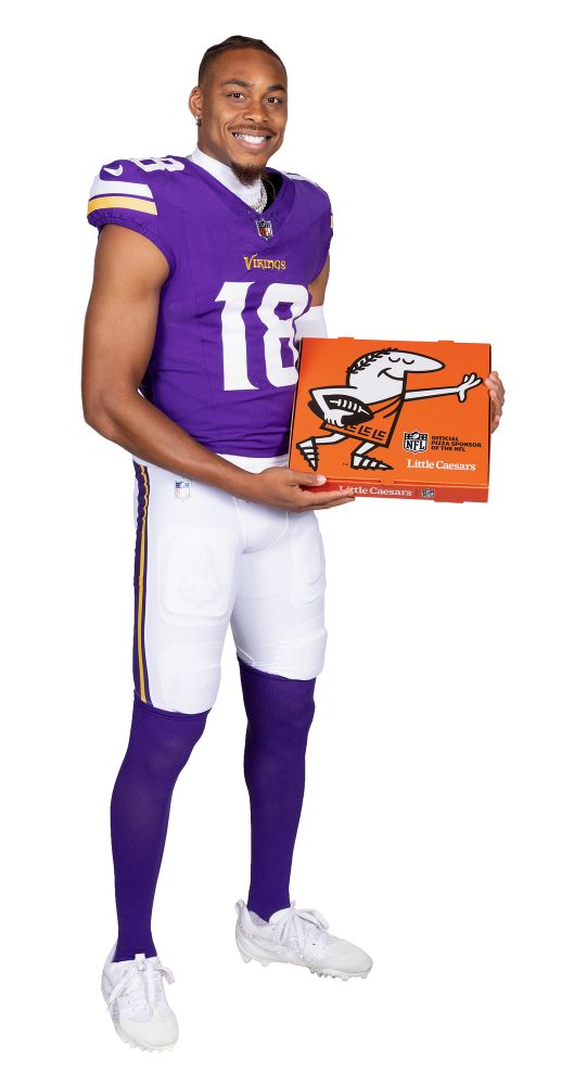 Justin Jefferson holding a Little Caesars pizza box as part of the Little Caesars NFL partnership