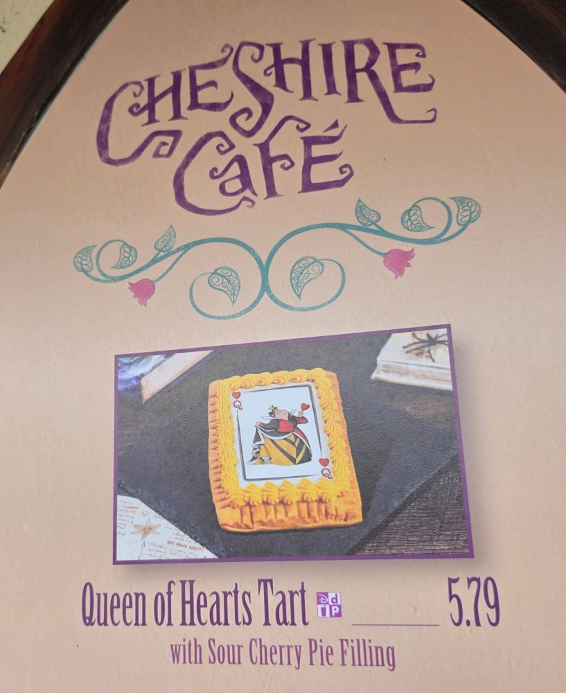 Exterior view of Cheshire Café quick-service kiosk with cottage architecture at Magic Kingdom in Walt Disney World.