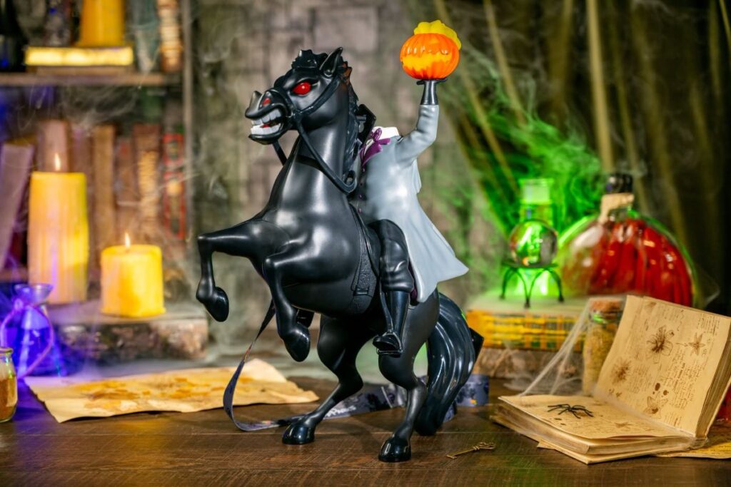 Disney Halloween novelty popcorn bucket of the Headless Horseman rearing up on a black horse while holding a flaming jack-o'-lantern head aloft