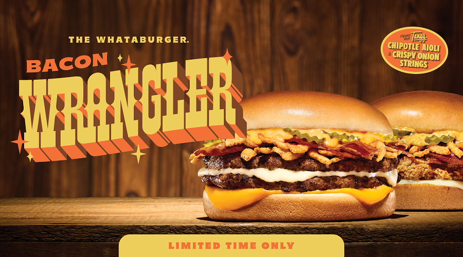 A Whataburger Bacon Wrangler burger with double patties, bacon, crispy onion strings, and cheese on a wooden table against a rustic wood background.
