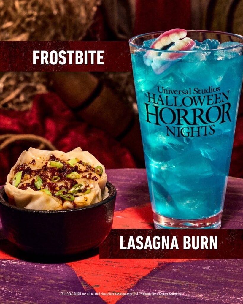 Halloween Horror Nights Food: Lasagna Burn dumpling dish, served in a cast-iron bowl, alongside a bright blue Frostbite specialty cocktail garnished with gummy teeth.