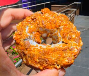 Detailed view of Butterfinger doughnut served at Voodoo Doughnut CityWalk Orlando