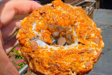 Detailed view of Butterfinger doughnut served at Voodoo Doughnut CityWalk Orlando
