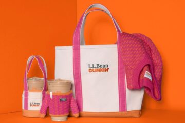 An L.L.Bean x Dunkin' canvas tote bag, a matching mini tote, two iced coffee cups with knit sleeves, and a pink and orange knit hat on orange for Dunkin L.L.Bean fall collaboration