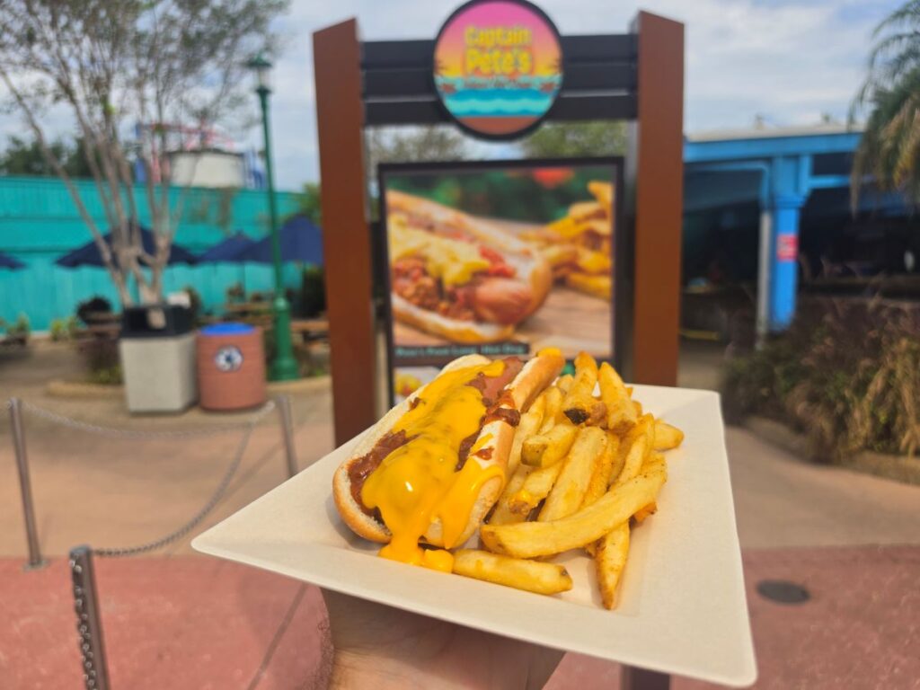 hot dog with chili and cheese shown in front of Captain Pete's Hot Dogs