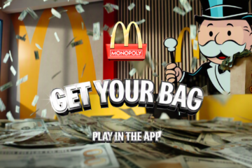 Mr. Monopoly stands in a McDonald's restaurant as cash falls around him, with the text Get Your Bag and Play In The App displayed prominently.
