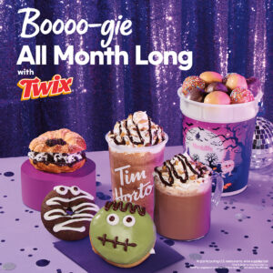 Tim Hortons Halloween menu items, including Twix-themed treats, a croissant, donuts, a frozen drink, and a bucket of Timbits, set against a purple sequin backdrop.