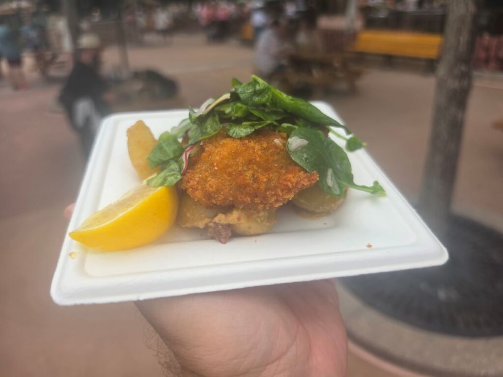 Wiener Schnitzel on a white plate for Epcot Food & Wine