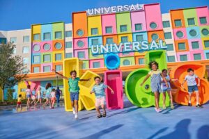 Universal Kids Resort marquee with children playing in front of it.
