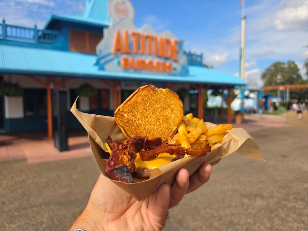 Burger shown with cheese and bacon