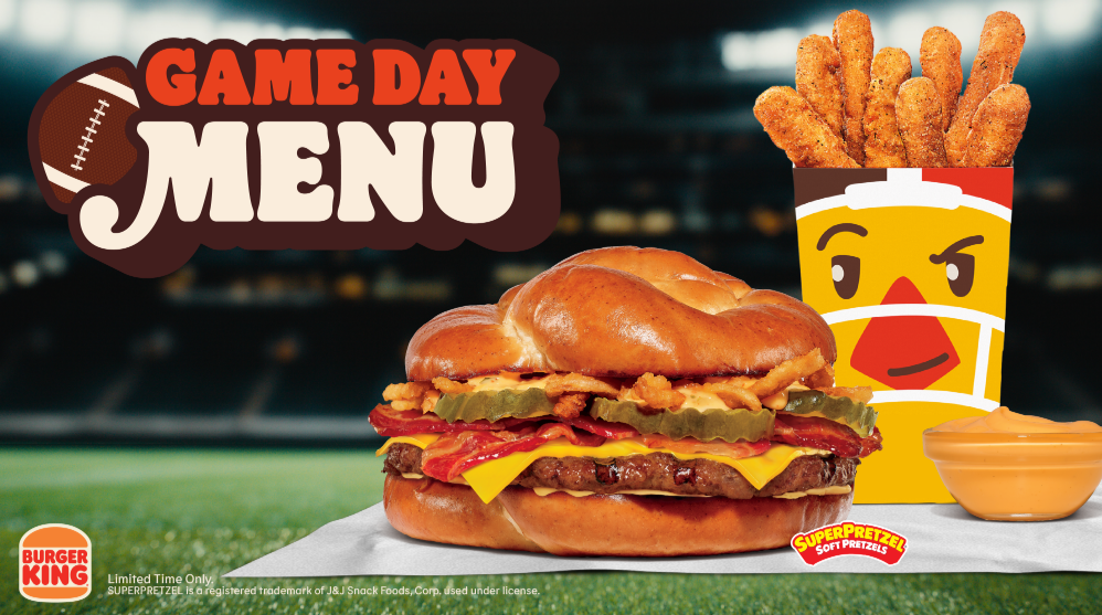 A Burger King Game Day menu features a pretzel bun burger, a container of pretzel sticks with a face, and cheese dip on a football field background.