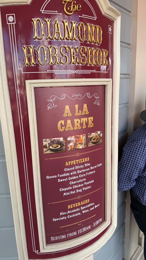 Diamond Horseshoe Lounge menu sign outside