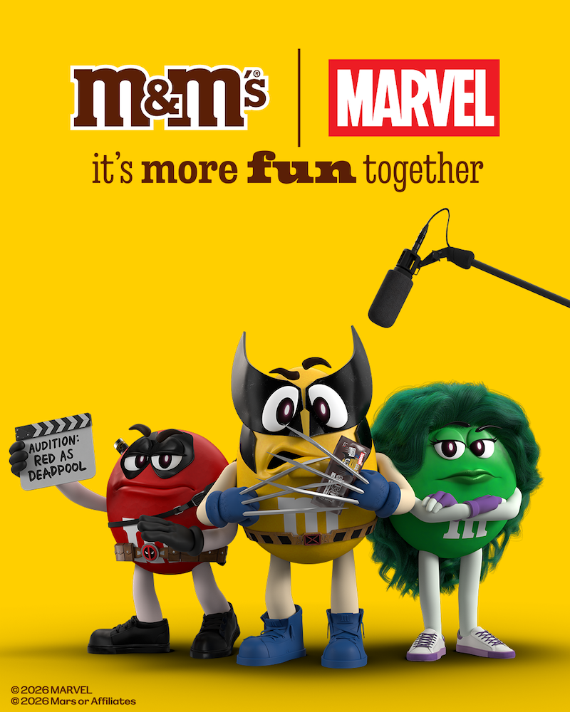 Three M&M's characters dressed as Marvel heroes—Deadpool, Wolverine, and She-Hulk—stand against a yellow background with a microphone overhead.