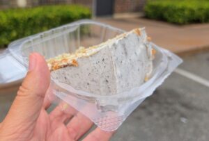 Cake slice shown in an opened plastic container