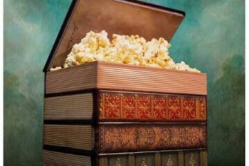 The Sense and Sensibility popcorn bucket which is a stack of vintage-style books with the top cover open, revealing a pile of popcorn inside, promoting the film Sense and Sensibility in theaters.